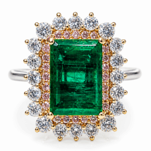 6.28 Ct Colombian emerald framed by white and pink diamonds in platinum & 18K gold